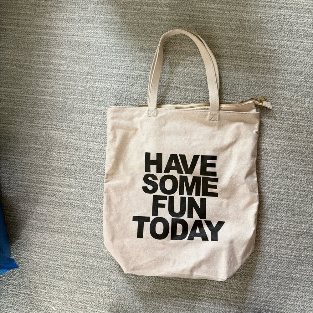 Chic Cream Canvas Tote with Bold Black Text